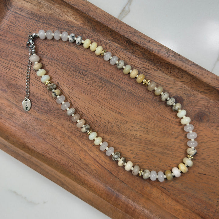 Necklace with small beads on a wooden surface